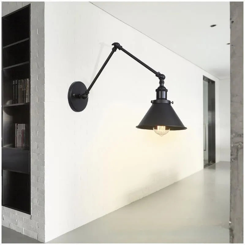 Rocker arm wall lamp with retractable folding arm in iron shade, available in black, gold, or rust