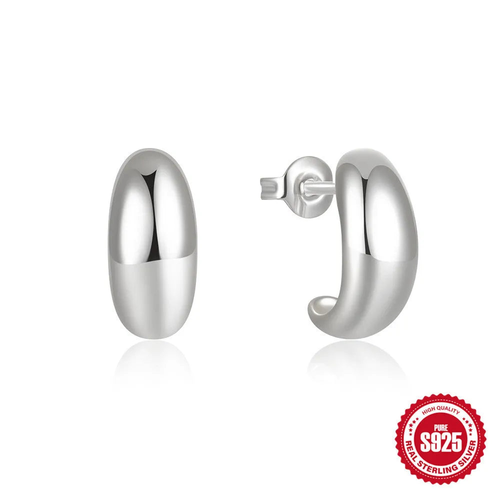Sterling silver C-shaped stud earrings with glossy electroplated finish