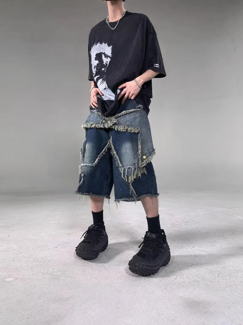 Blue denim shorts with frayed five-pointed star design and loose fit construction