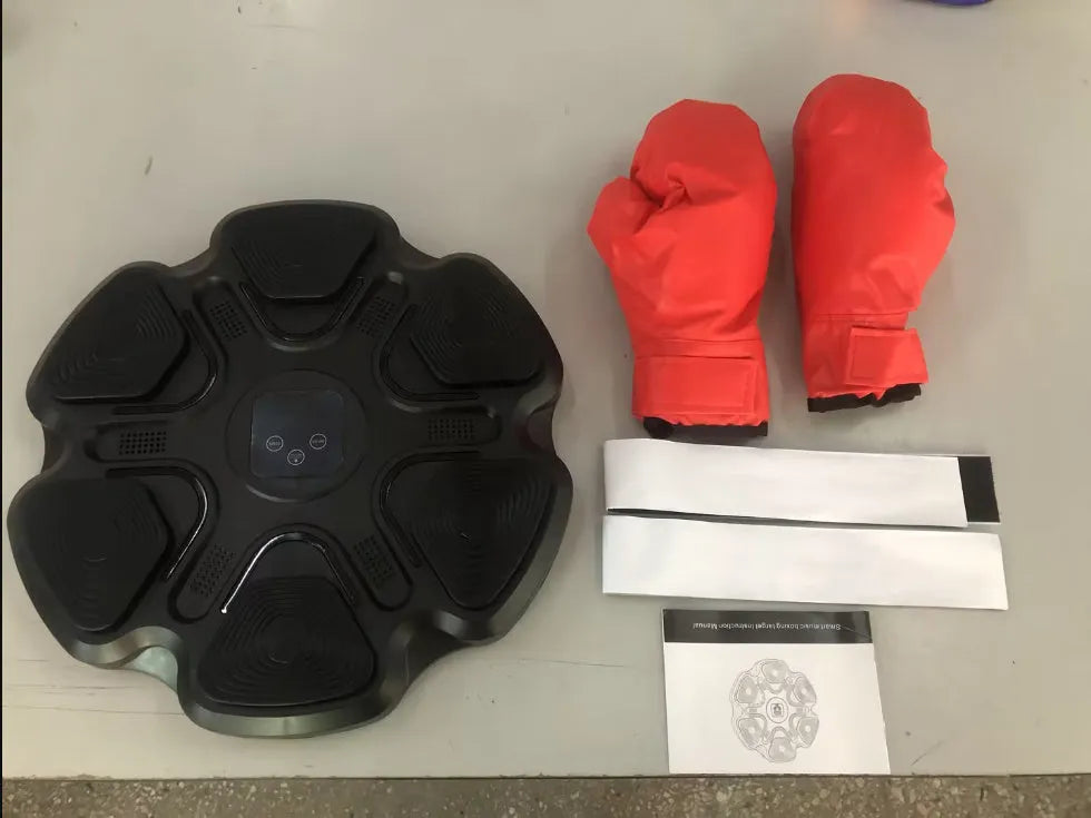 White smart music boxing machine wall target with focus gloves mounted on a wall.