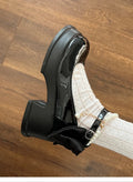 Women's black and beige Mary Jane pumps with a chunky heel and round toe.